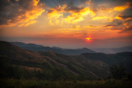 Scenic view dramatic beautiful sunset sky. Natural Sunset Sunrise on meadow silhouette shadow dark...