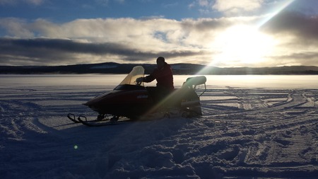 Snowmobile on Frozen Lake, Vilhelmina, Swedenのeditorial素材