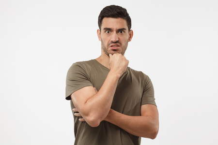 What the hell? Young caucasian male disgusted by something bad. Frustration concept. Puzzled unhappy  negative emotionsの写真素材