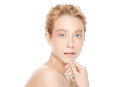 Young beautiful blond blue-eyed female with shoulders, isolated on white backgroundの写真素材