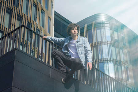 Young male student doing parkour and freerun in the cityの写真素材