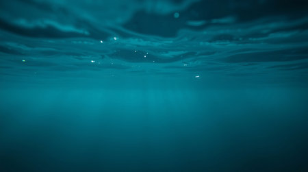 Underwater view of the surface of the sea with waves and bubblesの素材
