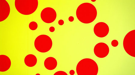 abstract red circles on a yellow background, closeup of photoの素材
