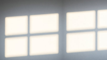 Shadow of window on white wall. Shadow of window on white wall.の素材