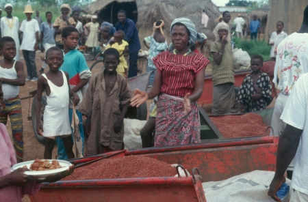 West african rural market woman selling milletの写真素材