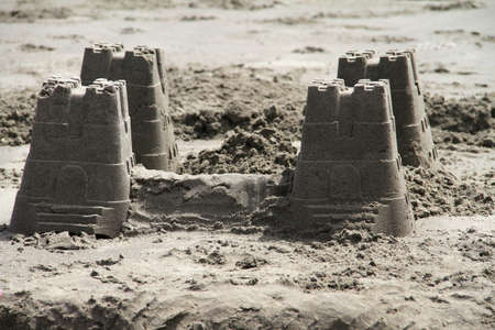 A small sand castle made out of buckets.の写真素材