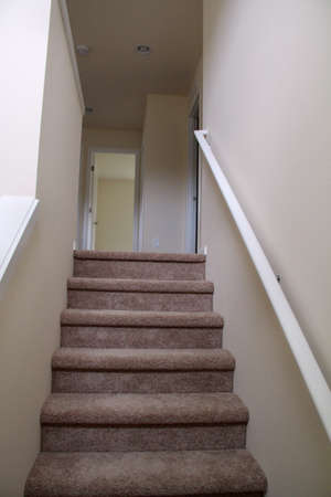An empty stairs and hallway in a new home.の写真素材