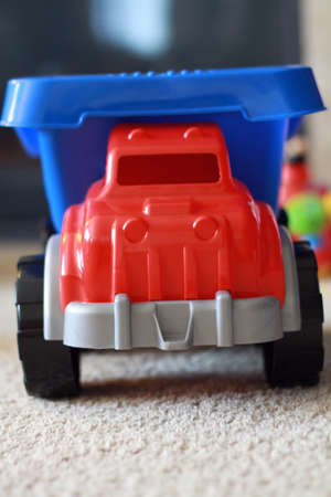 Close up of a blue and red toy dump truck.の写真素材