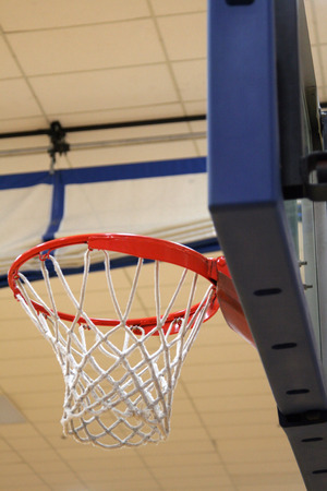 Basketball hoop in an indoor gym.の写真素材