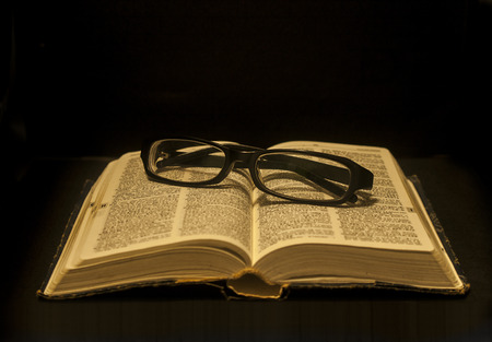 Glasses on dictionary