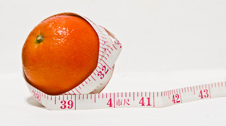 Measuring orangesの写真素材