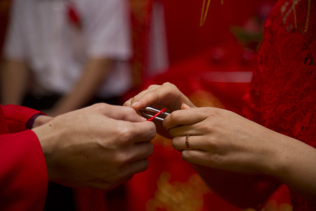 Close up of hand in the Chinese wedding ceremonyの写真素材
