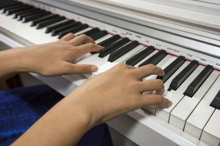 Pair of hands on the keyboard