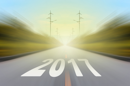 Empty asphalt road and New year 2017 concept.