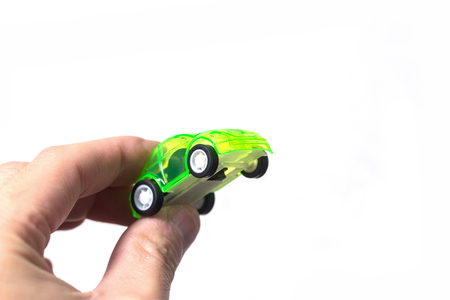 Hand holding car model on white backgroundのeditorial素材