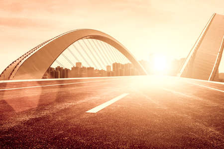 The forward city road, the Nanning Bridge in Guangxi under the backlight.