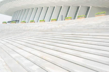 The curved steps of the outdoor sunken plaza of Guangxi Art Center, China.
