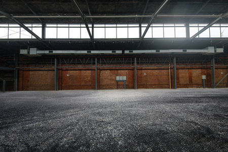 Old warehouse factory building space with no people, industrial style.の写真素材