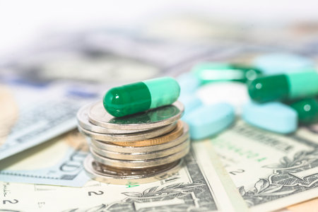 Pills and capsules on the background of the dollar. The concept of expensive medicine.