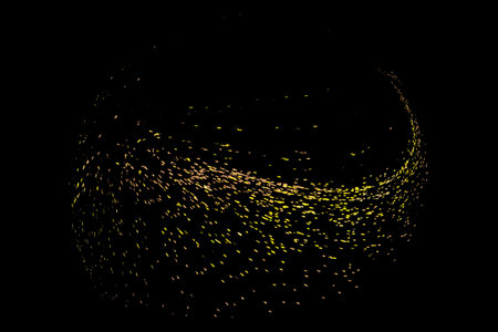 Abstract background with dynamic particles. Gold particles converge on a black background.の写真素材