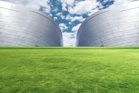 Modern architecture with green grass and blue sky background. 3d rendering