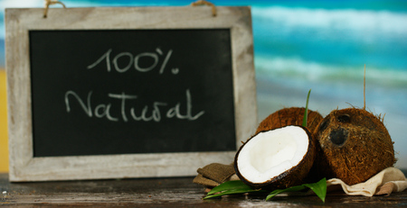 Delicious fresh nutritious coconut milkshake on the background of the sea and sky, the concept:...