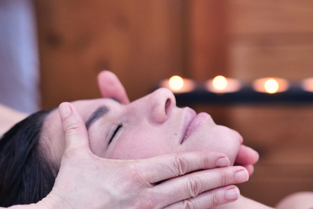 Close up of a beautiful woman in a wellness center. Concept of: spa, relaxation, rest, massageの写真素材
