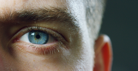 perfect blue eye macro in a sterile environment and perfect vision in 6k resolution, concept, the vision of the future and healthy life concept. precise and straight to the target.の写真素材