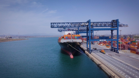 Beautiful view from the height (drone), view of a large cargo ship with blue sky and blue sky.の写真素材