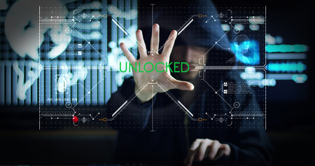 Hacker tries to enter the system using codes and numbers to find the security password.The hacker enters the software to steal login information.Concept: immersive technology, augmented realityの写真素材