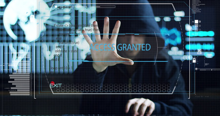 Hacker tries to enter the system using codes and numbers to find the security password.The hacker enters the software to steal login information.Concept: immersive technology, augmented realityの写真素材