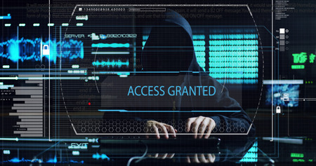 Hacker tries to enter the system using codes and numbers to find the security password.The hacker enters the software to steal login information.Concept: immersive technology, augmented realityの写真素材