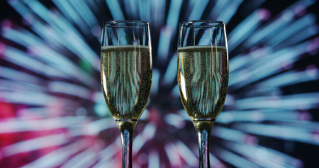 Champagne toast while in the background break out the fireworks. Concept: new year, love, holidays, party.の写真素材
