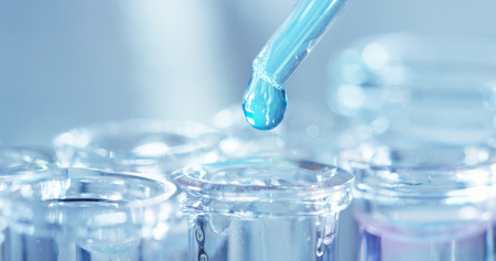 in a laboratory, a scientist with a pipette. Concept: research, biochemistry, nature, pharmaceutical medicineの写真素材