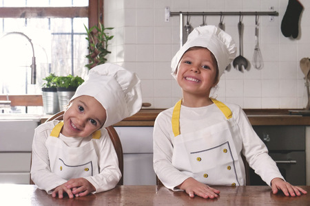 Professional chefs looking at camera with professional chefs looking at camera. Concept of: healthy nutrition, cooking schoolの写真素材