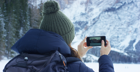 girl in front of the camera concept of technology and love for sports and natureの写真素材
