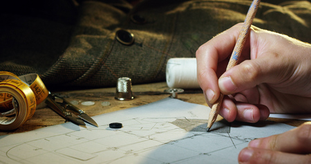 A close up of a young woman is sketching a new project.