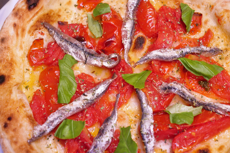 Italian gastronomy. Concept of: pizza, Italian tradition, Naples, Mediterranean flavorsの写真素材