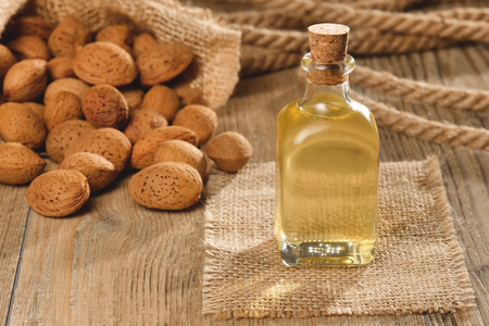 Almond oil composition used for cosmetics, spa, wellness centers. Perfect body oil and moisturizing skin. Concept of: beauty, oils, creams, wellness.の写真素材