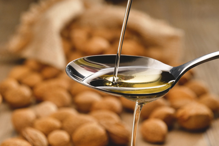 Almond oil composition used for cosmetics, spa, wellness centers. Perfect body oil and moisturizing skin. Concept of: beauty, oils, creams, wellness.の写真素材