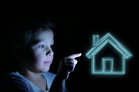 A little girl with her finger presses in front of her. Concept of: future, network, technology, security for children.の写真素材