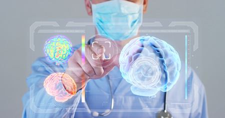 A futuristic doctor, a surgeon, a brain hologram, a medical mask, a blue robe. Concept futuristic medicine, doctors, laboratory, future, scienceの写真素材
