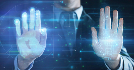 Businessman handprint leaning on glass for biometric scan. concept of surveillance and security through human fingerprints in the future of digital technology.の写真素材
