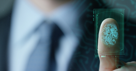 businessman scan fingerprint biometric identity and approval. concept of the future of security and password control through fingerprints in an immersive technology future and cybernetic, businessの写真素材