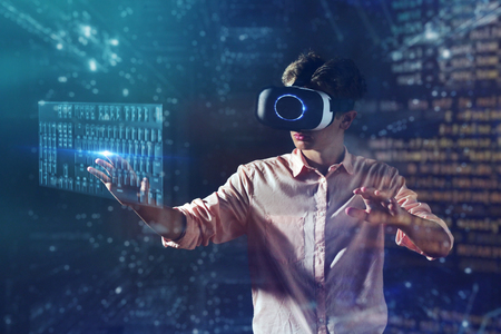 new technologies, a boy uses a futuristic processor for augmented reality. high technology and communication concept. gamerの写真素材