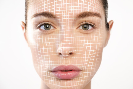 Futuristic and technological face scanning for a beautiful woman. It can serve to ensure personal safety. Concept of: future, security, scanningの写真素材