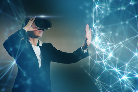 New technologies: a businessman uses a futuristic processor for augmented reality. high technology and communication concept.の写真素材