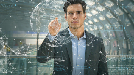 Futuristic businessman, student in a suit, uses a holographic hologram for the world's fast, speed Internet, connect with contacts, quick search, location Concept business future, network, connection.の写真素材
