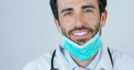 close up portrait of a surgeon or doctor with mask ready for operation in hospital or clinic.の写真素材