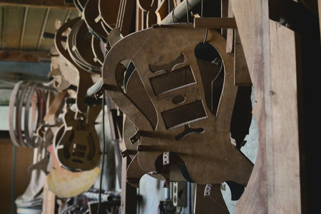 Close-up of a guitar maker, in which you can see pieces of guitars to be assembled. Concept of: music, tradition, ancient crafts.の写真素材